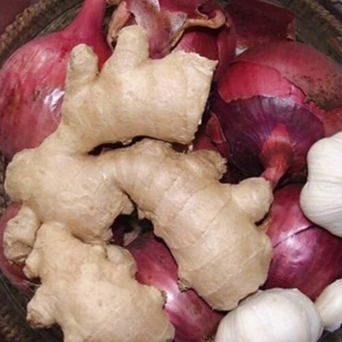 bowl containing garlic, onion and ginger for homemade cough syrup