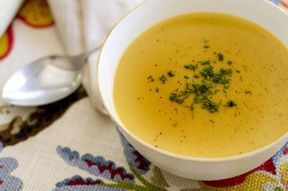 butternut squash soup in a bowl with parsley