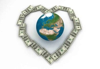 globe surrounded by dollar bills in the shape of a heart